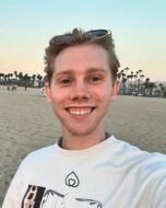 White man (John Sieber) with short blonde hair on a beach